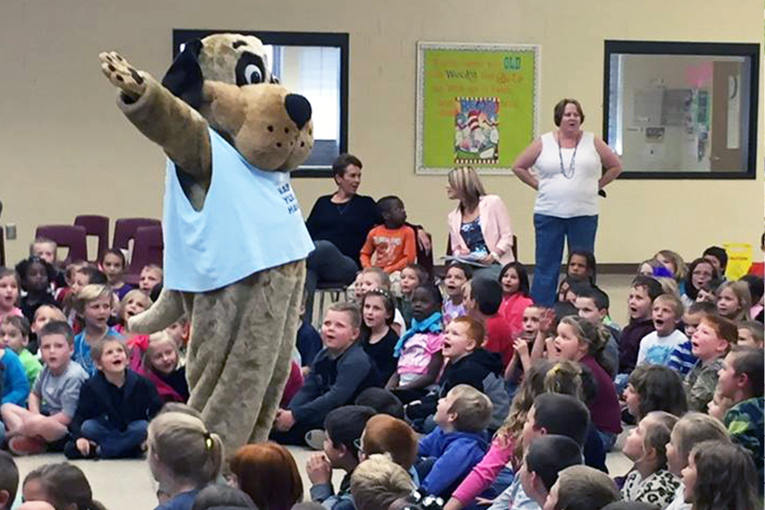 Biscuit the Dog in a school assembly