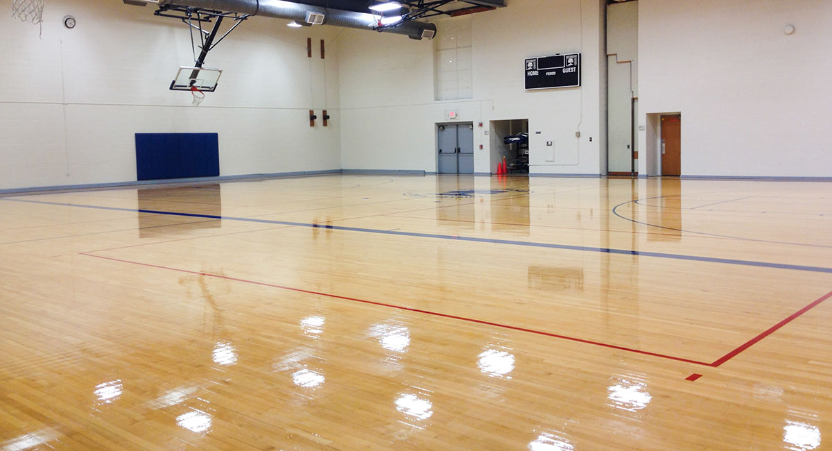 A glossy wood floor in a gym setting
