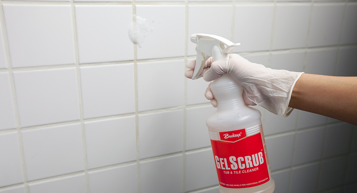 Gel Scrub Grip & Go being sprayed on tile wall