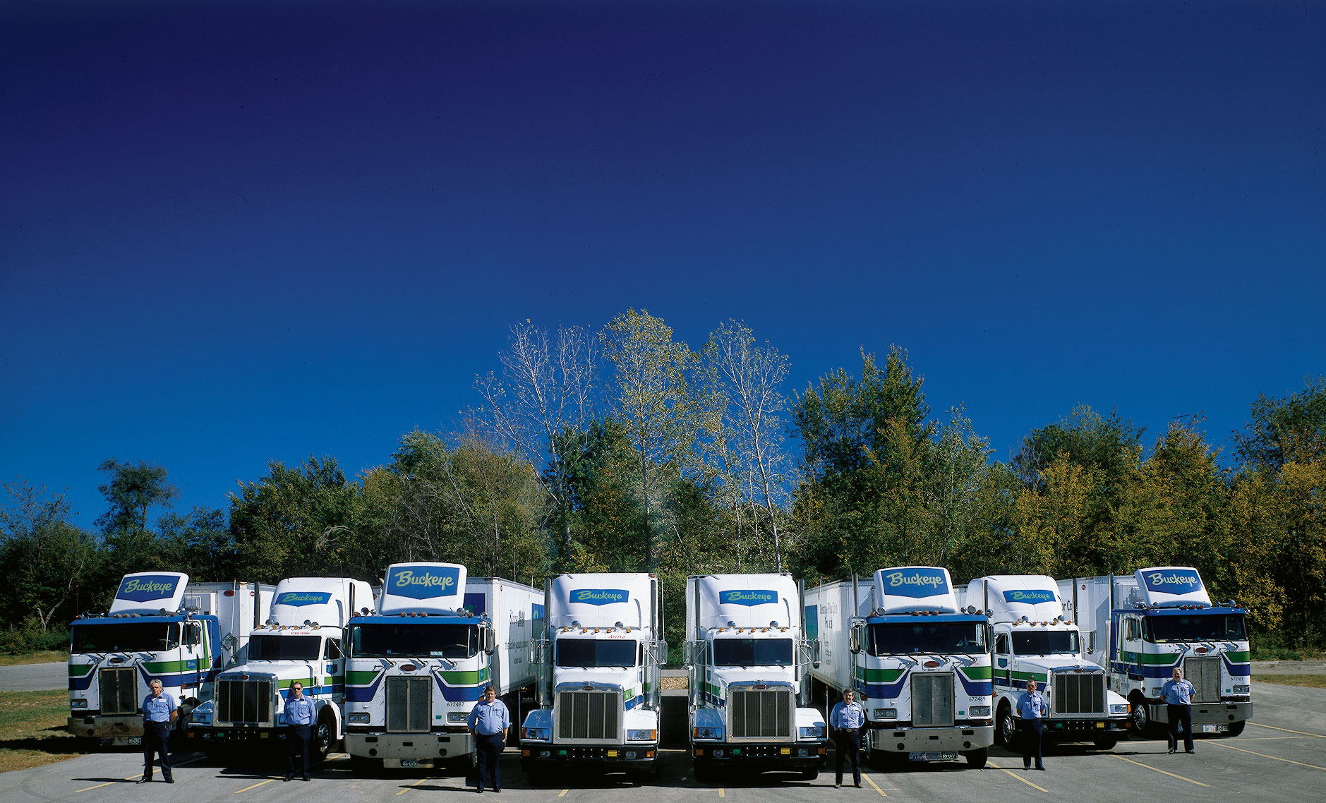 Buckeye trucks and drivers lined up in a parking lot